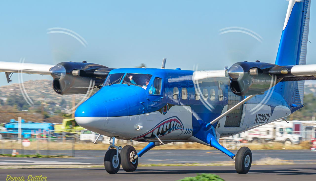 Blue and white twin turbine airplane painted like a shark